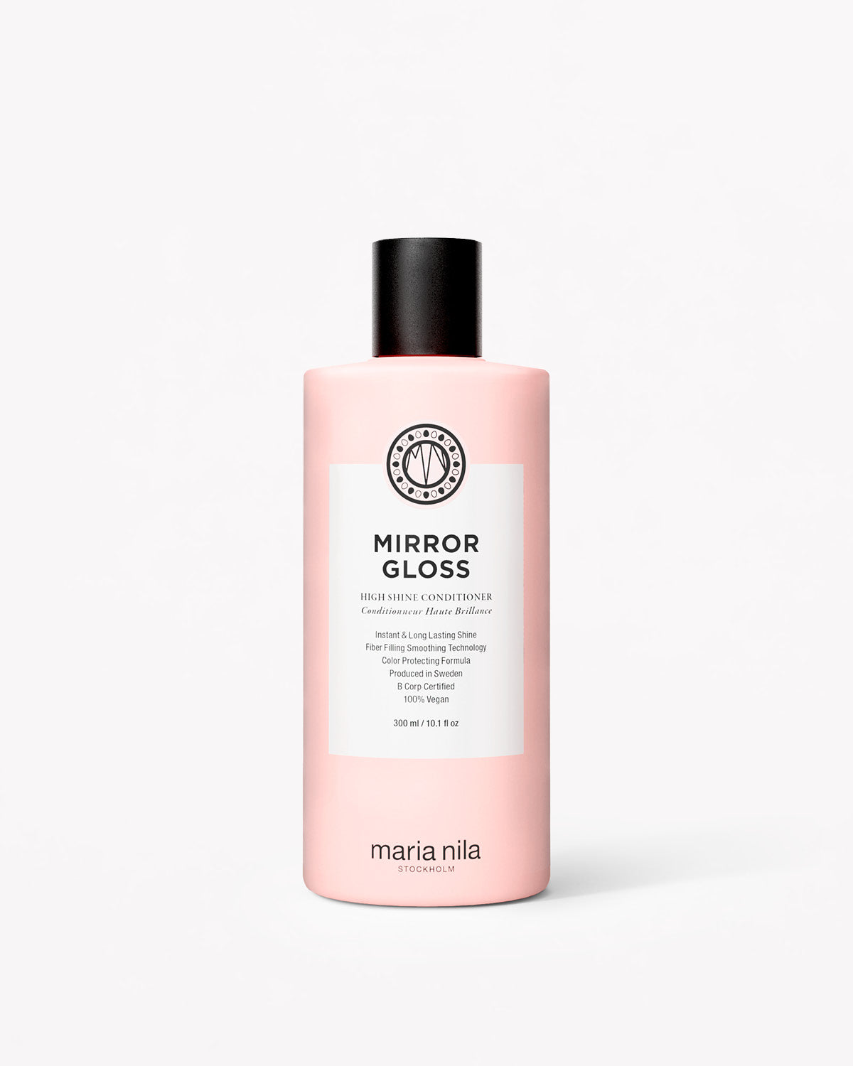 Rosa flaska med svart skruvkork och vit etikett för Mirror Gloss Conditioner från Maria Nila.