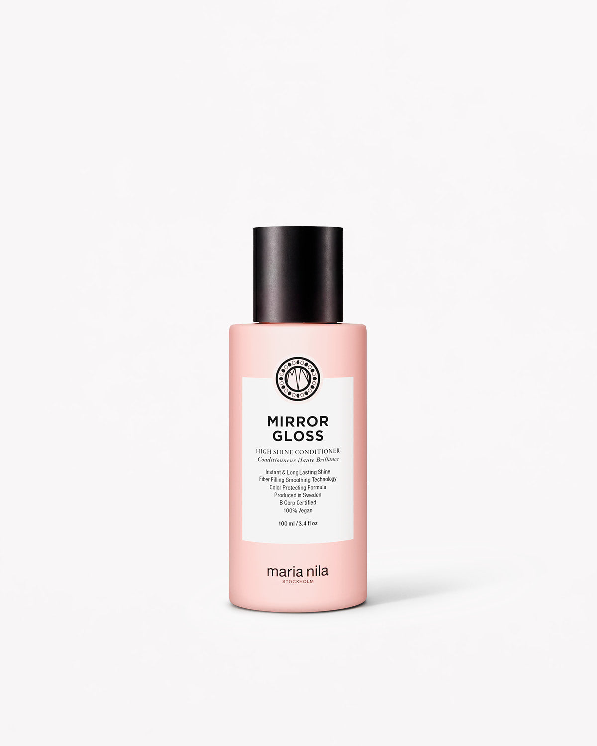 Rosa resa-flaska med svart lock och vit etikett för Mirror Gloss Conditioner från Maria Nila.
