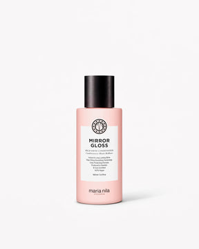 Rosa resa-flaska med svart lock och vit etikett för Mirror Gloss Conditioner från Maria Nila.