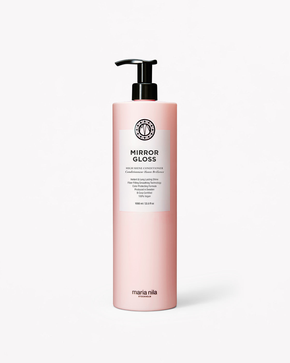 Ljusrosa flaska med svart pumplock och vit etikett för Mirror Gloss Conditioner, 1 liter.