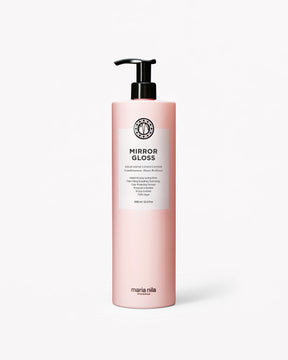 Ljusrosa flaska med svart pumplock och vit etikett för Mirror Gloss Conditioner, 1 liter.