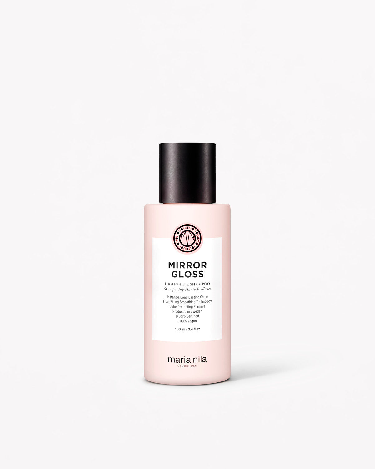 Rosa reseflaska med svart lock, Mirror Gloss Shampoo från Maria Nila, minimalistisk design.
